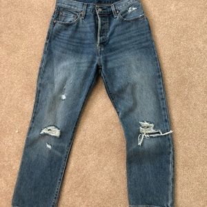 Dark wash ripped Levi’s 501 jeans
